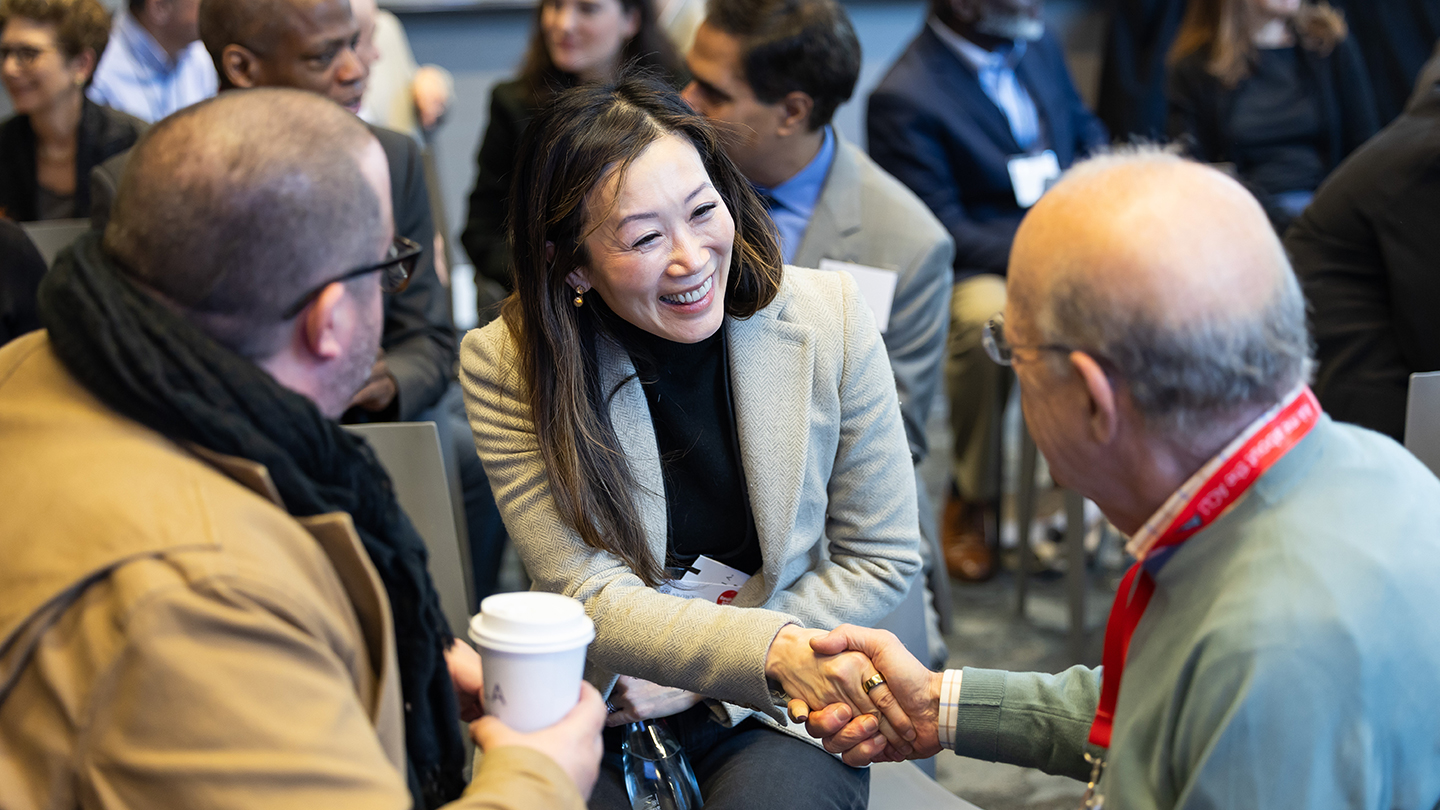 Brown volunteers chatting at the Volunteer Summit