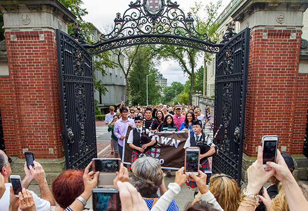 Proud family taking photos of their students at Convocation